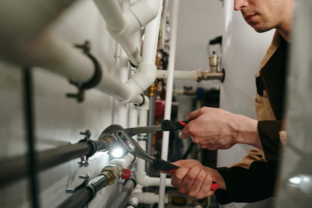 Plumbers maintaining commercial plumbing pipes in Lemon Grove