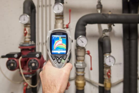 Plumber using a thermal imaging camera to inspect pipes in Lemon Grove