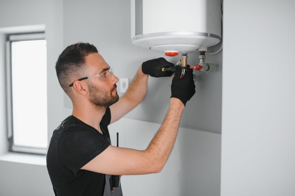 Technician performing water heater maintenance in Lemon Grove