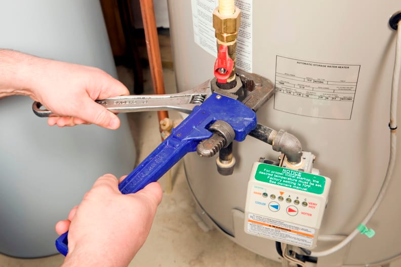 Plumber repairing a water heater valve in Lemon Grove